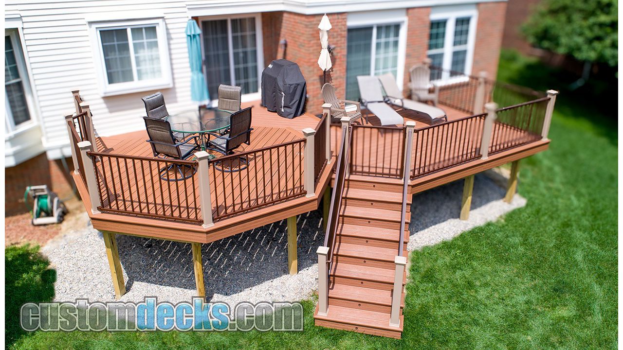 Transcends Tiki Torch decking and Bronze Signature railing with Rope Swing posts