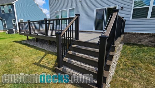 Enhance Rocky Harbor decking with Spiced Rum border and black Signature railing with Spiced Rum drink rail