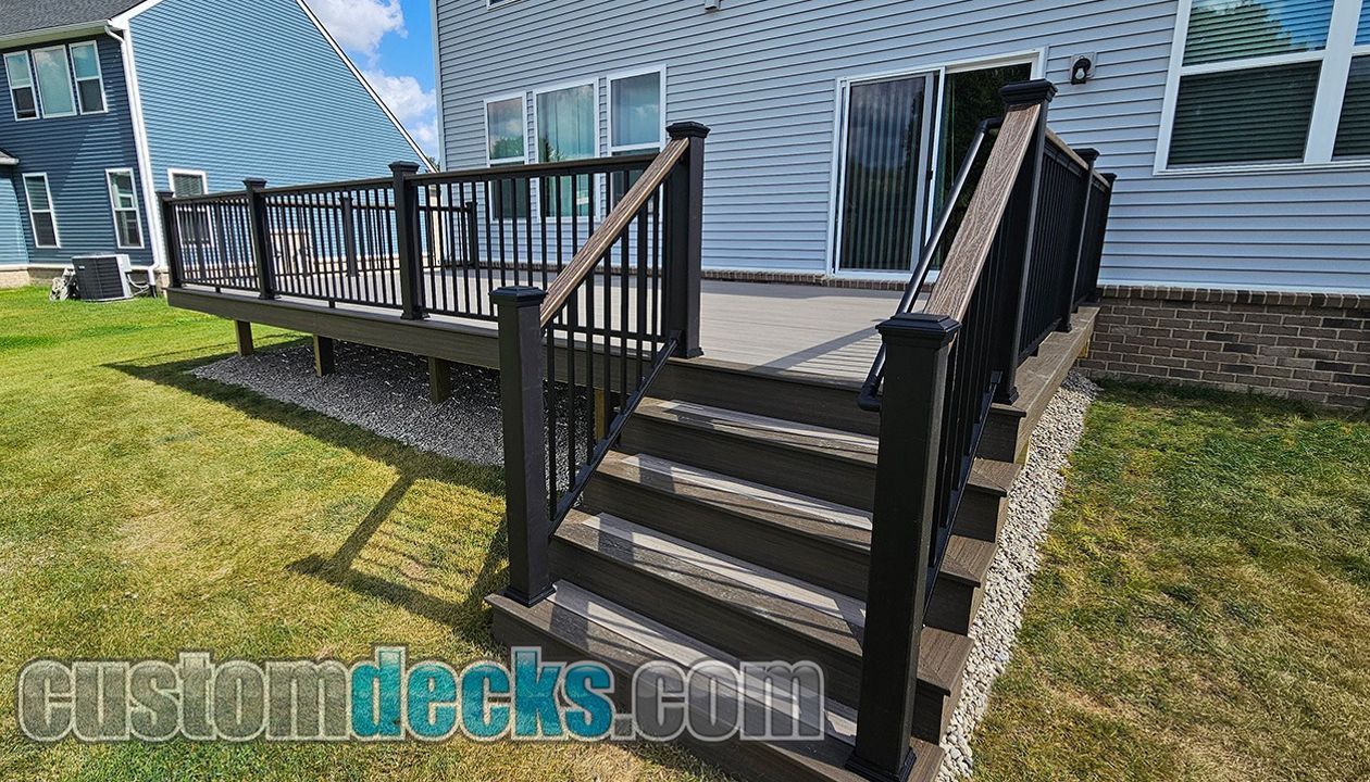 Enhance Rocky Harbor decking with Spiced Rum border and black Signature railing with Spiced Rum drink rail