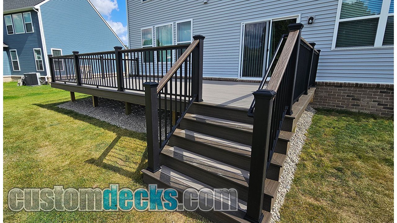 Enhance Rocky Harbor decking with Spiced Rum border and black Signature railing with Spiced Rum drink rail