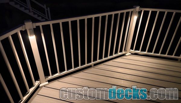 Wedge lights on White Signature aluminum railing with Foggy Wharf Decking and Island Mist border