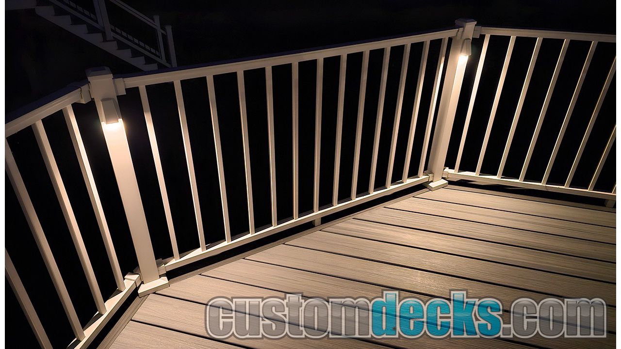 Wedge lights on White Signature aluminum railing with Foggy Wharf Decking and Island Mist border