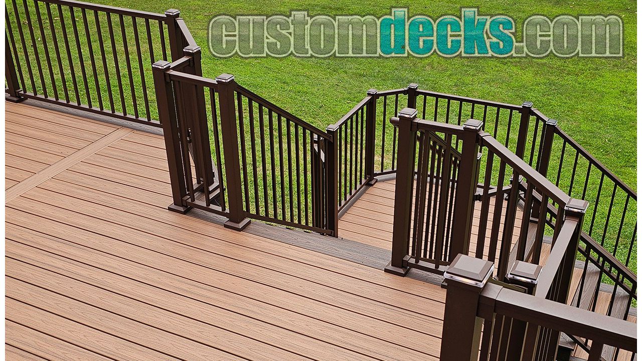 Transcends Tiki Torch decking with Spiced Rum border and Bronze Signature railing with matching post cap lighting