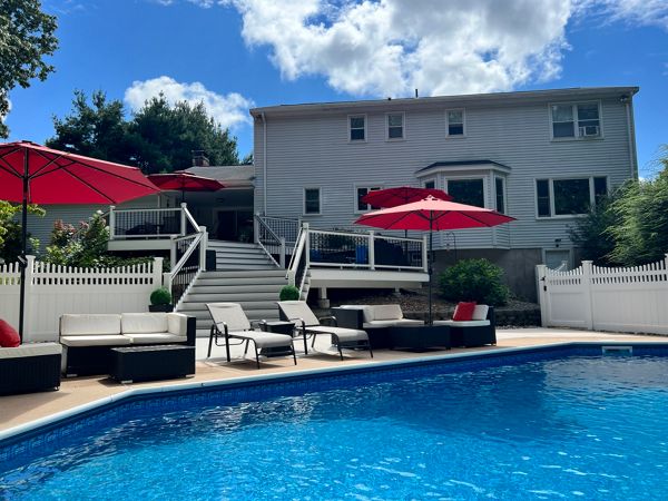 Multi-level deck with pool and umbrellas