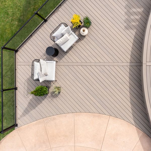 9. An aerial view of a Trex deck in the color Biscayne with some nice deck furniture featured on the deck. 