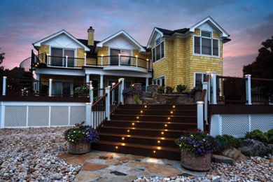 https://images.trex.com/is/image/trexcompany/trn-monmouth-005-sr-vl-overall-sunset-lighting-spiralstairs-1:Secondary-Hero