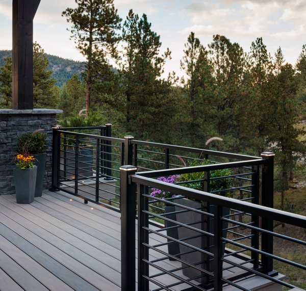 Exterior photography of 2023 HGTV Dream Home in Morrison, Colorado. Photography of Belgard Hardscape products and Trex composite decking and railing.