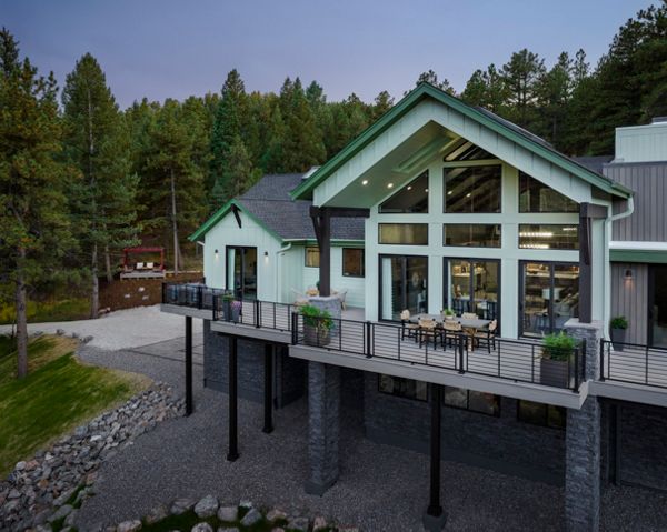 Exterior photography of 2023 HGTV Dream Home in Morrison, Colorado. Photography of Belgard Hardscape products and Trex composite decking and railing.