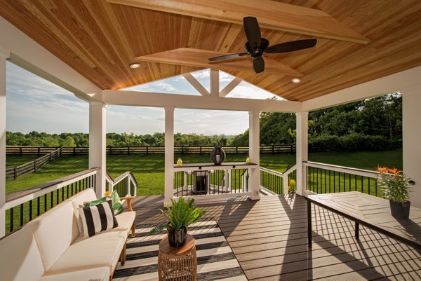 outdoor cocktail sitting area overlooking a backyard
