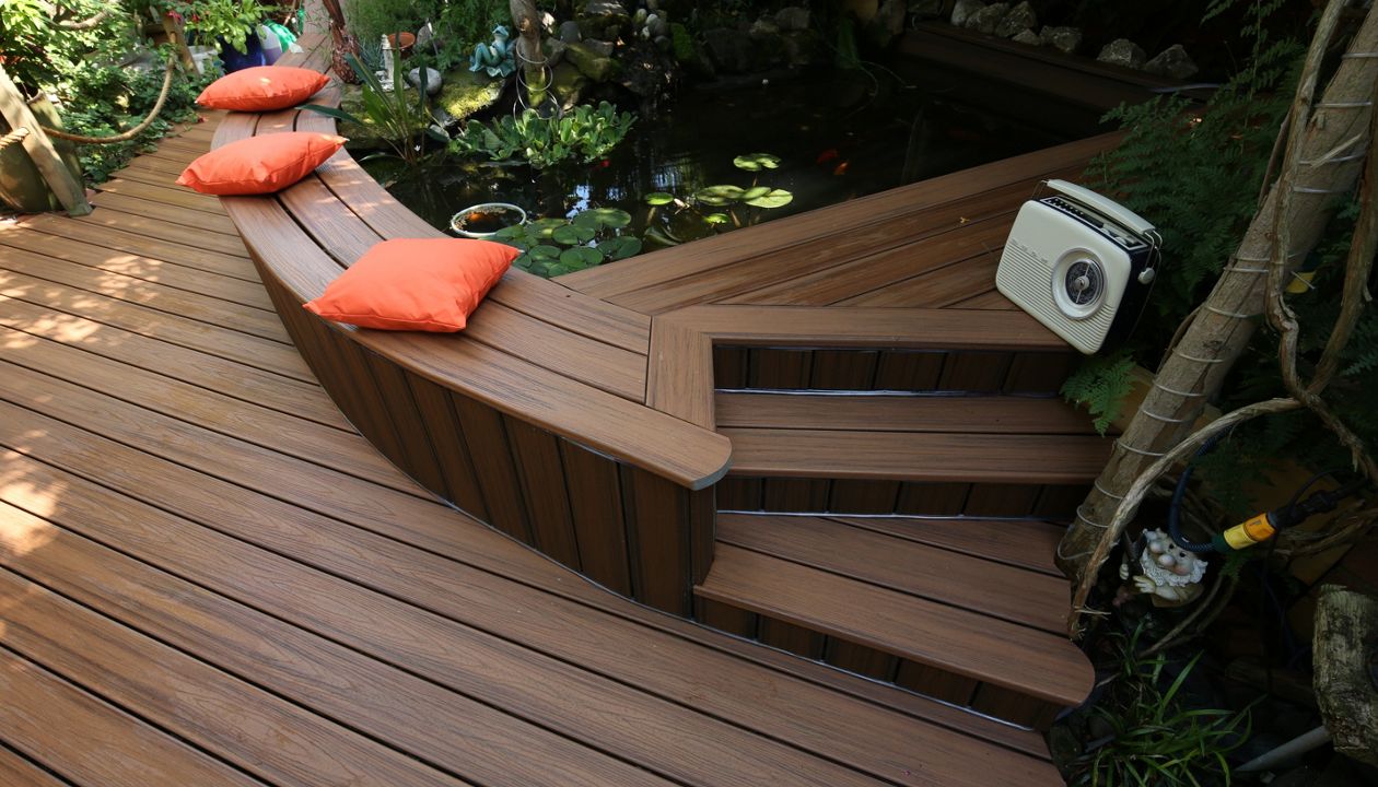 A garden deck made in Trex Transcend Tiki Torch. The garden space is completely covered in the shade of tall trees and the home, so it does not recieve much direct light.