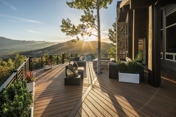 Deck built around a tree, overlooking mountains